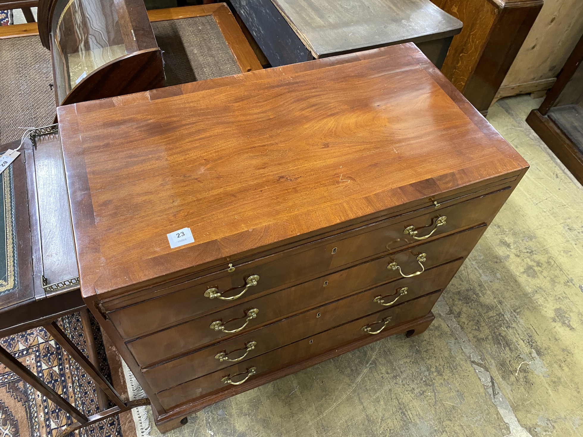 A George III style banded mahogany chest with brushing slide, width 92cm, depth 49cm, height 86cm